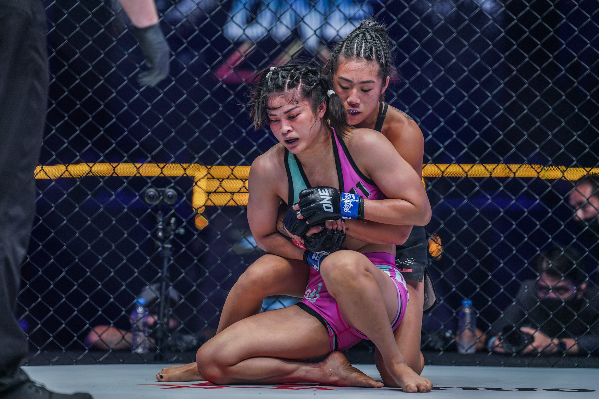 Angela Lee tries to control Stamp Fairtex from the back during the ONE Women's Atomweight World Championship fight at ONE X
