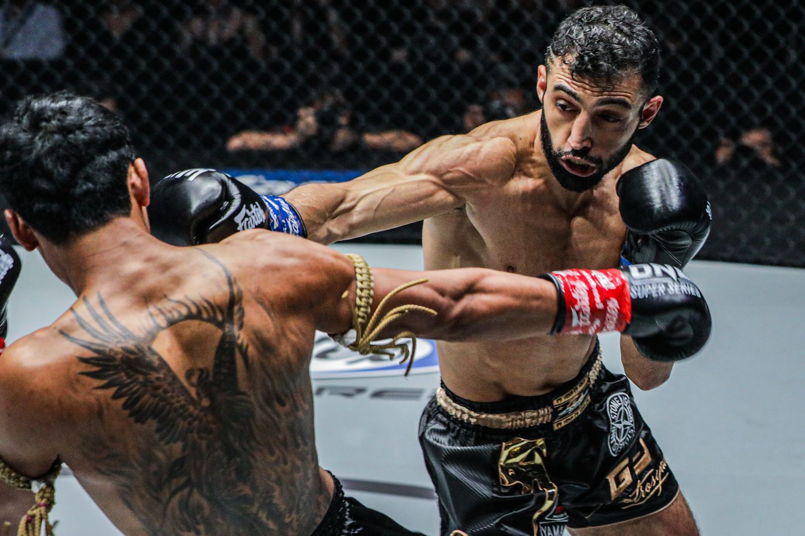 Italy's Giorgio Petrosyan connects with a jab on Jo Nattawut in Bangkok