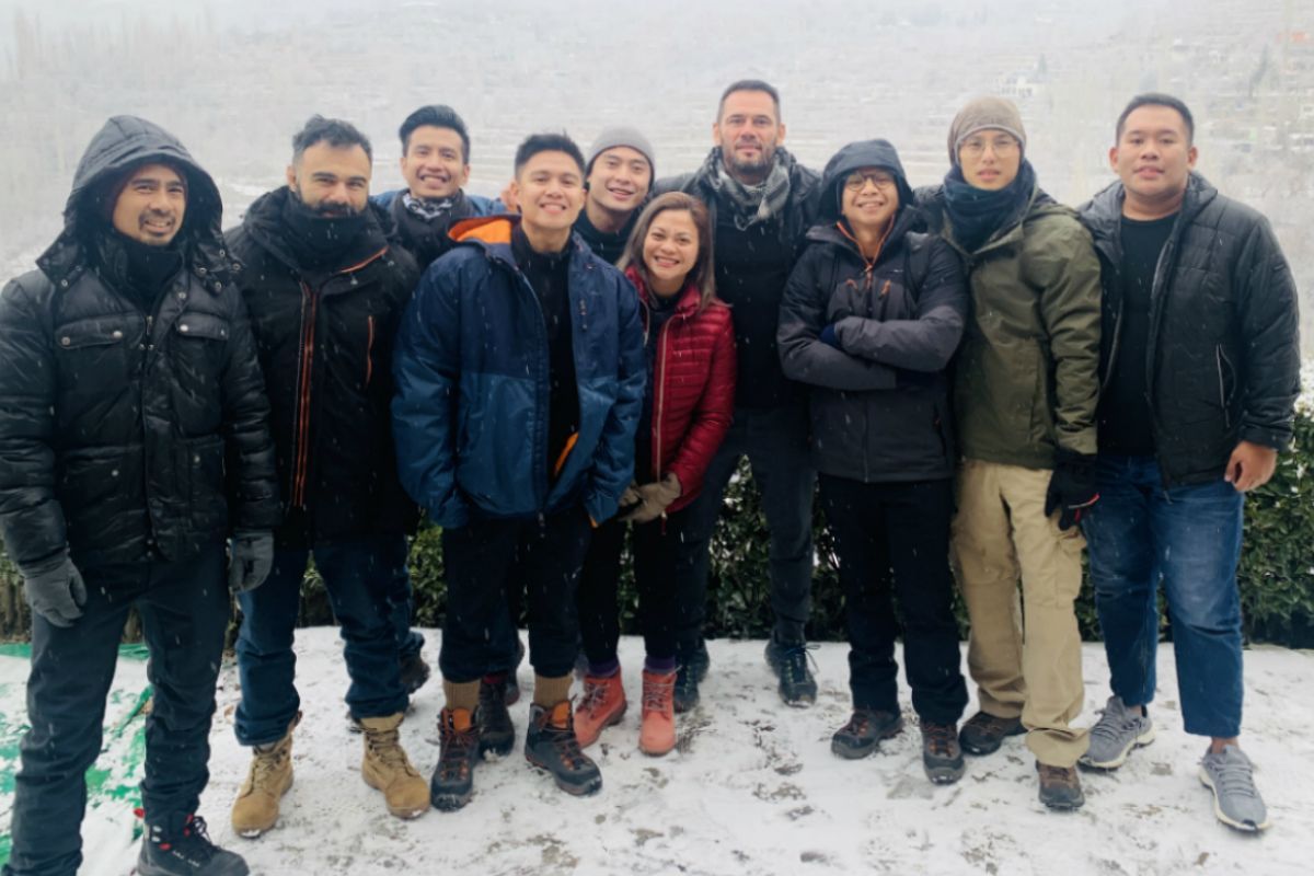 The staff of Rich Franklin's ONE Warrior Series stand in the cold of Pakistan