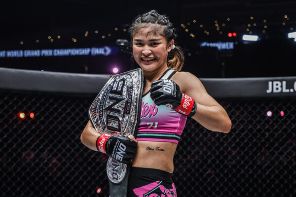 Stamp poses with the ONE Atomweight World Grand Prix title at ONE: WINTER WARRIORS.