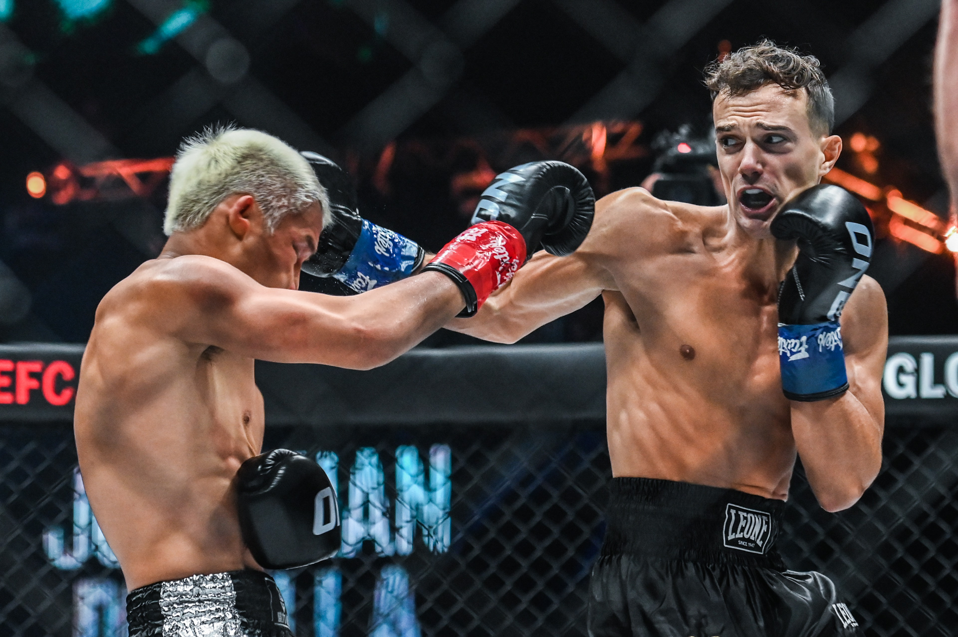 Jonathan Di Bella lands punches on Zhang Peimian